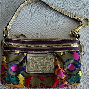 Coach bag . Gold with multiple colors.
